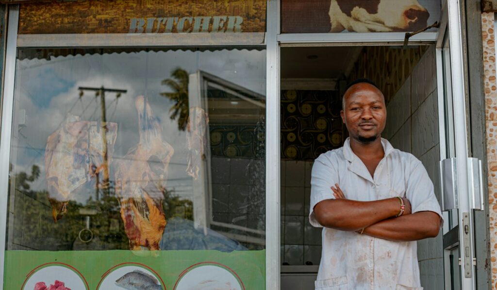 Small business owner in front of his shop – business owner strategies