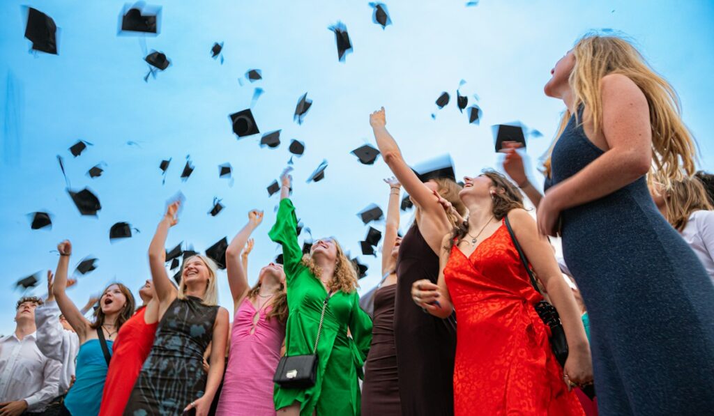 Graduates tossing caps – college savings plan