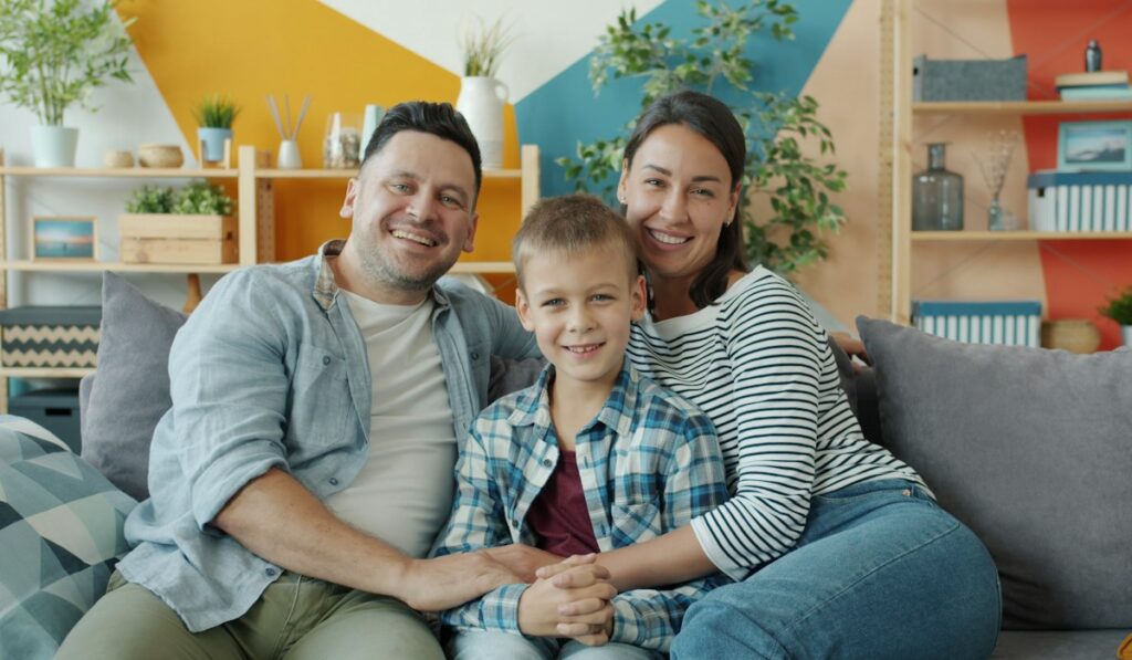 Happy family at home – life insurance protection